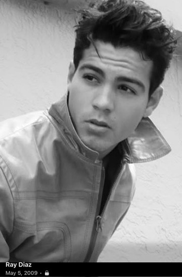 Ray Diaz in a leather jacket, black and white portrait