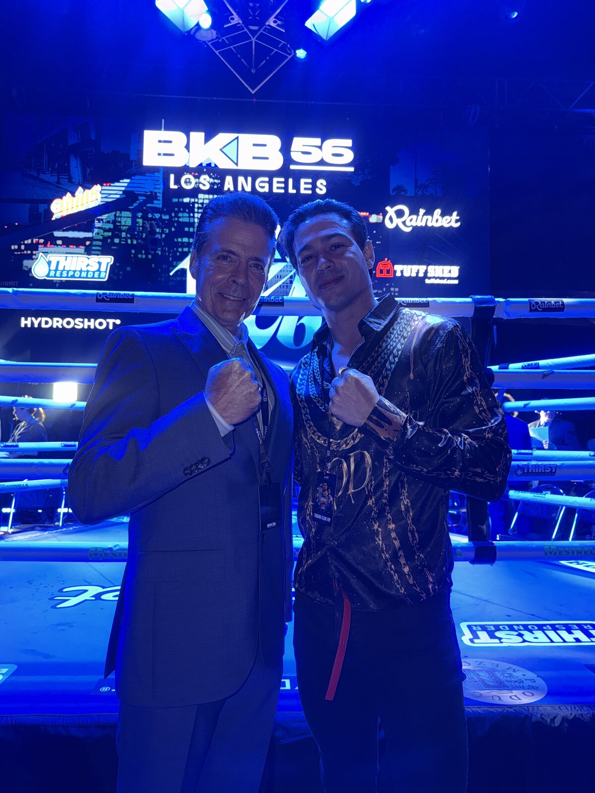 Ray Diaz in a black and gold robe ringside at Bare Knuckle Boxing 56 in Los Angeles with BKB CEO David Tetreault